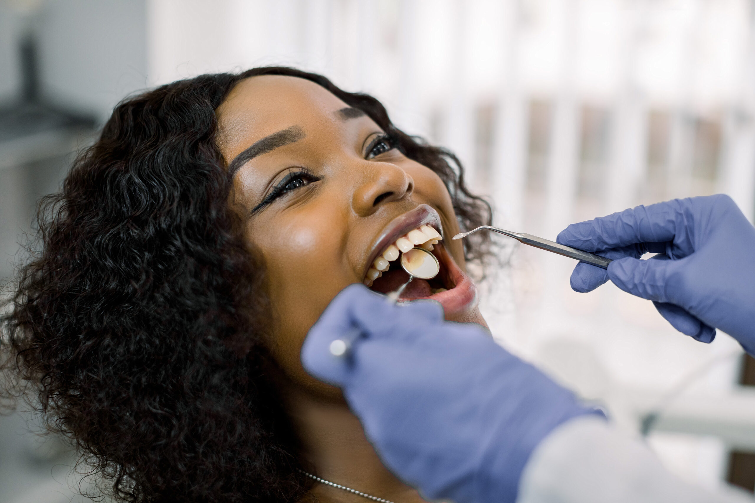 Close-up Portrait Of Woman Patient Having Dental Exam