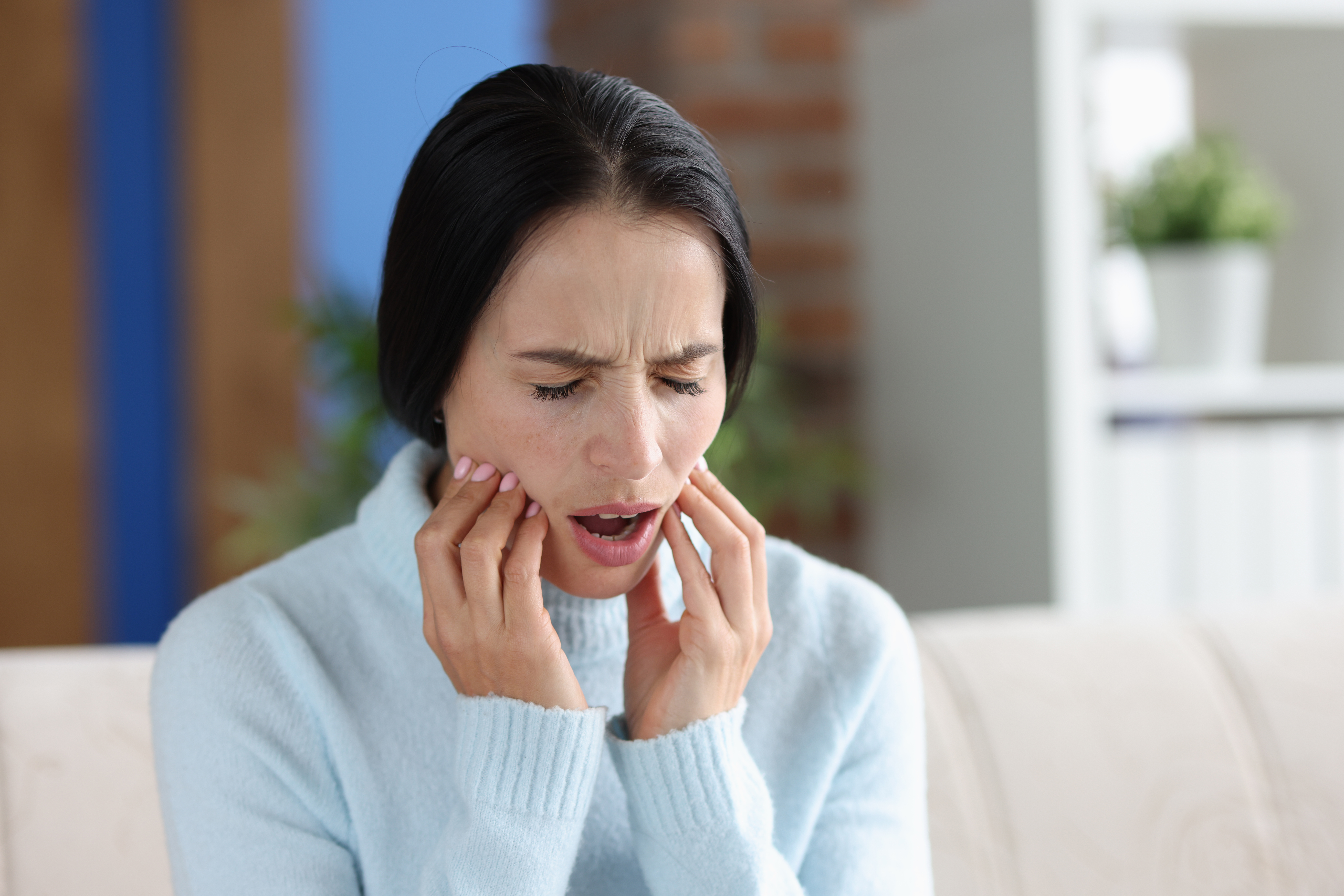 Woman with severe toothache.