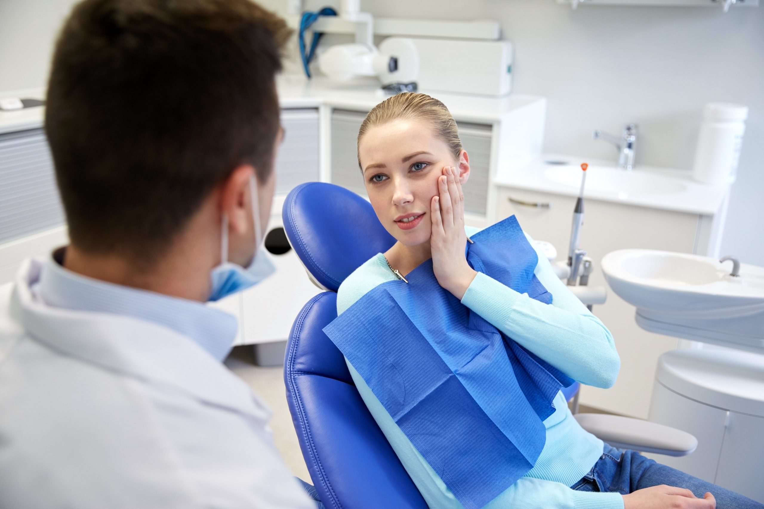 Woman receiving dental procedure.