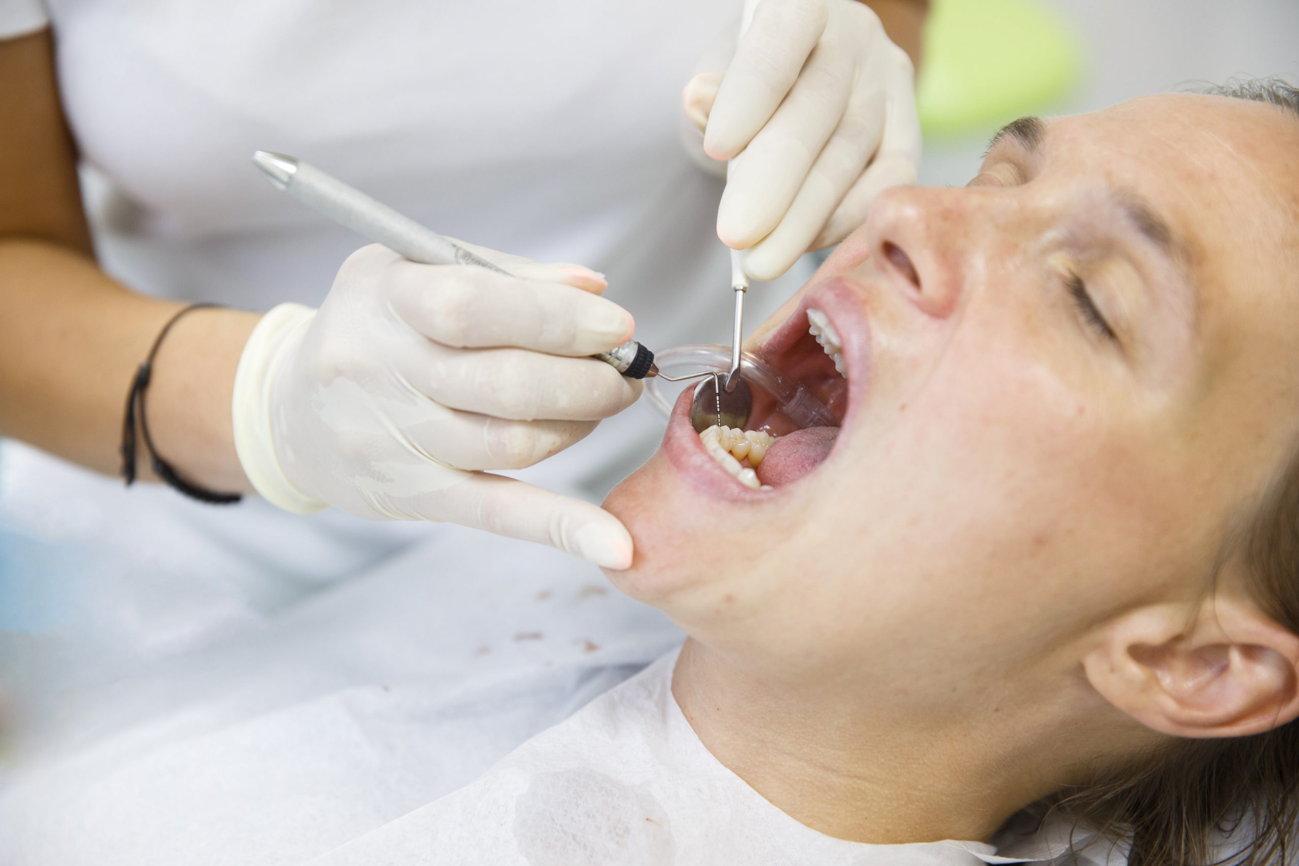 Man gets dental treatment.